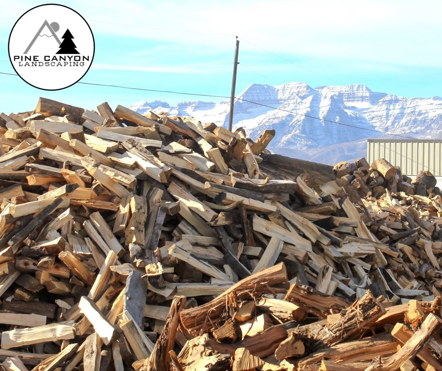 Split Pine Canyon firewood with the Wasatch Mountains beyond the Heber City yard