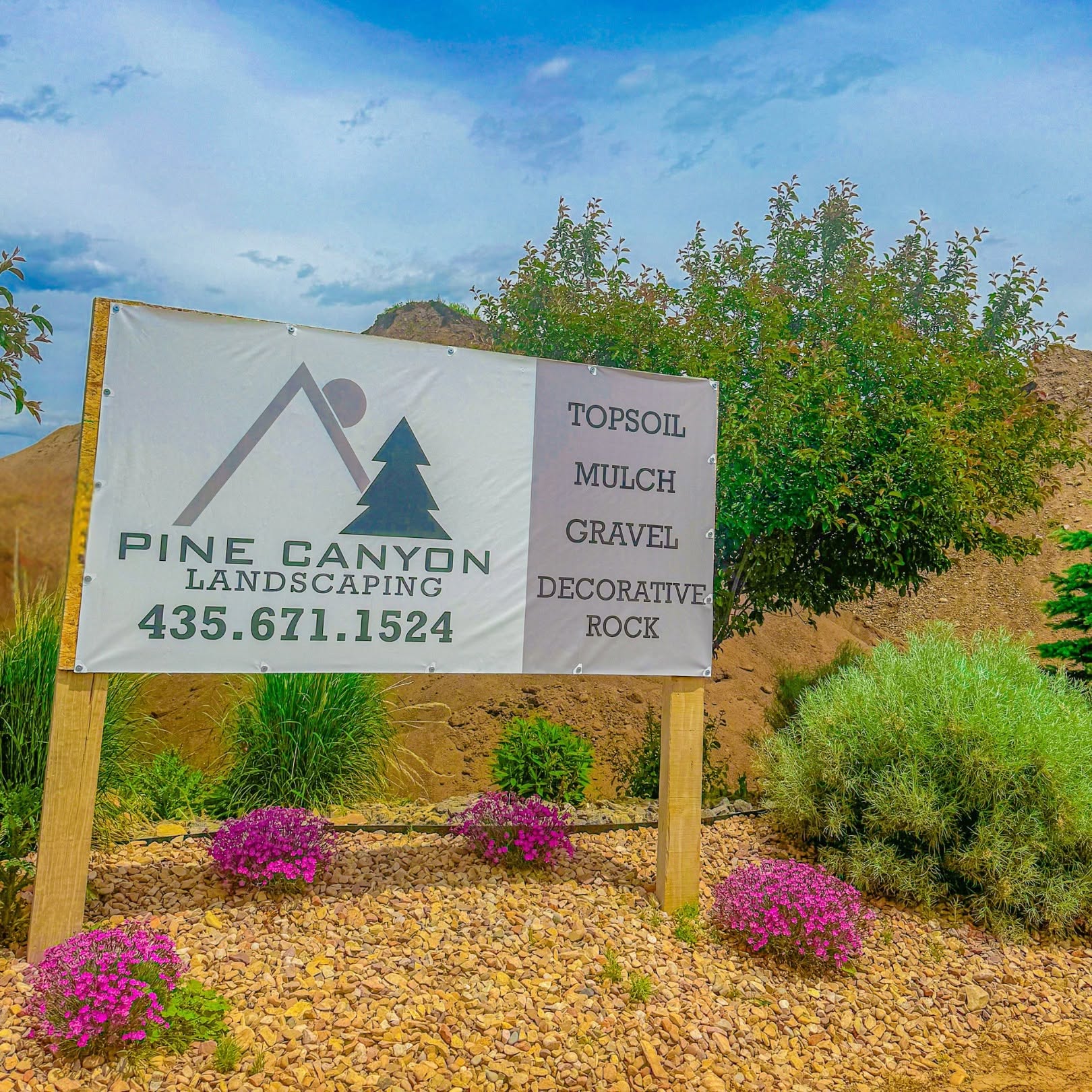 Physical Pine Canyon yard sign listing topsoil, mulch, gravel and decorative rock